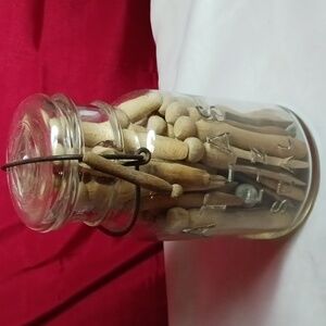 Antique atlas jar filled with antique clothes pins